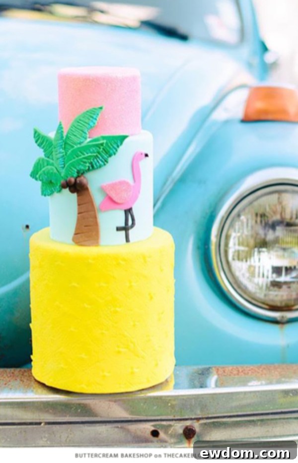 Vibrant yellow summer cake with fresh pineapple slice and pink flamingo design by Buttercream Bakeshop, perfect for a cheerful wedding or celebration.