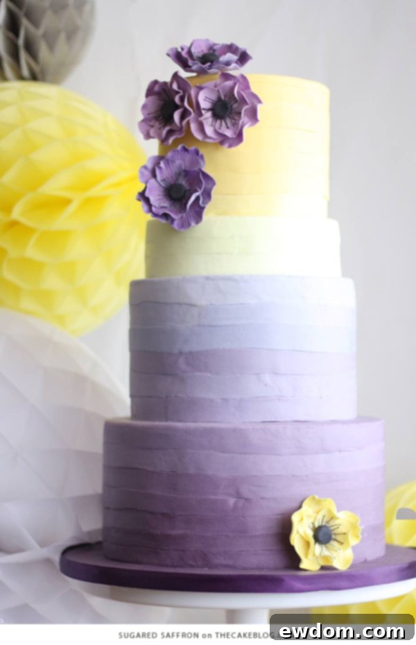 Towering ombre cake blending soft yellow shades into rich purples by Sugared Saffron, perfect for a sophisticated and modern event.