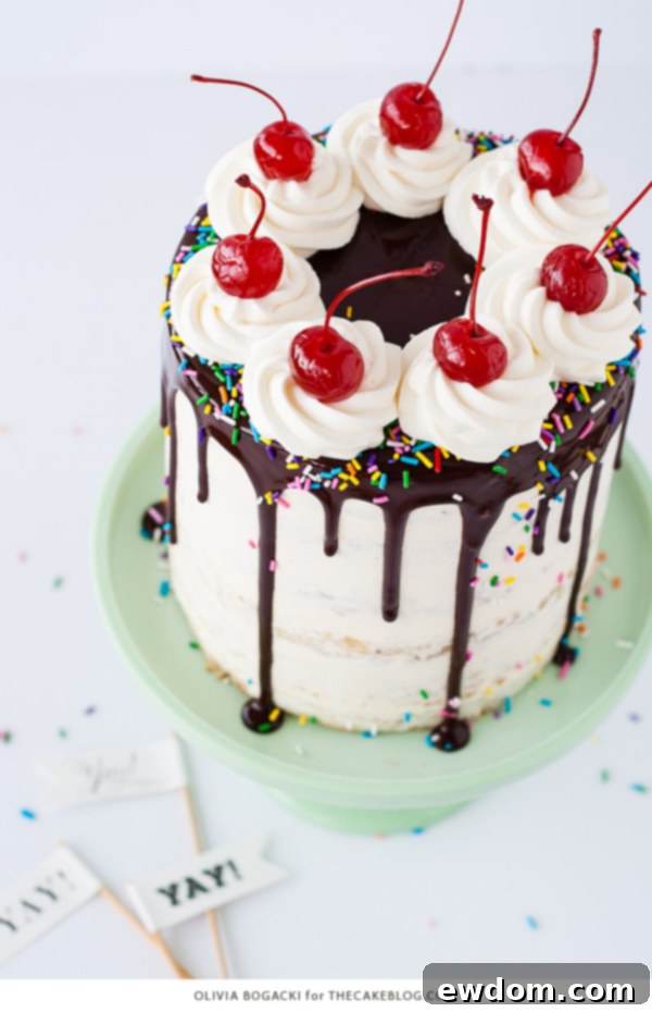 Ultimate Banana Split Cake 4 Banana Split Cake layers with pineapple and strawberry fillings, topped with ganache and whipped cream - a perfect summer treat | by Olivia Bogacki for TheCakeBlog.com