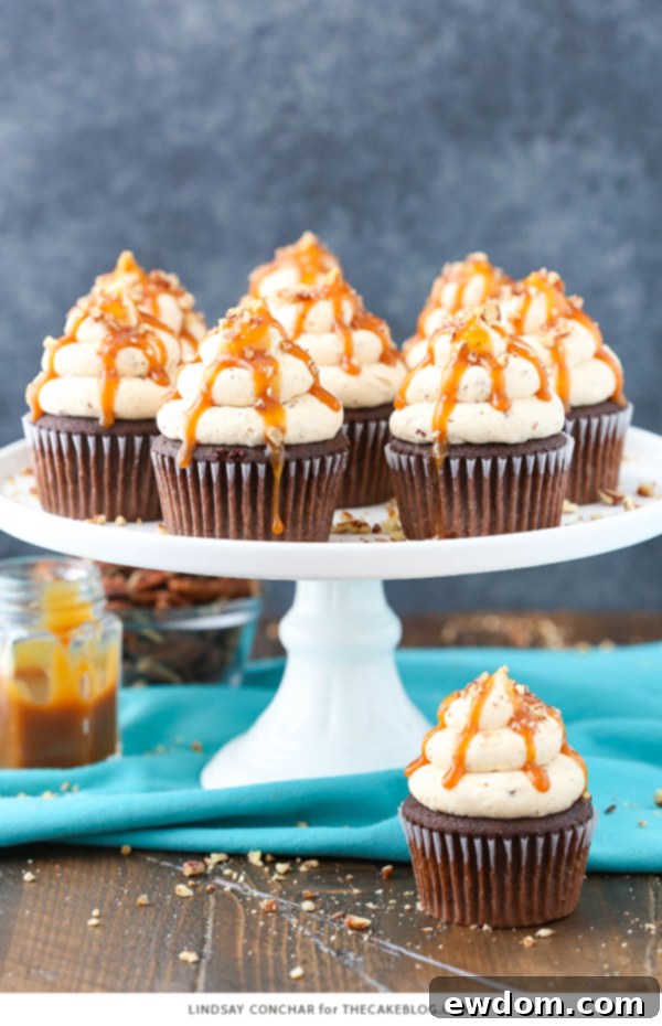 Gooey Chocolate Caramel Pecan Cupcakes 7 Chocolate Turtle Cupcakes - from scratch recipe for rich chocolate cupcakes with caramel pecan frosting, caramel drizzle and chopped pecans | by Lindsay Conchar for TheCakeBlog.com