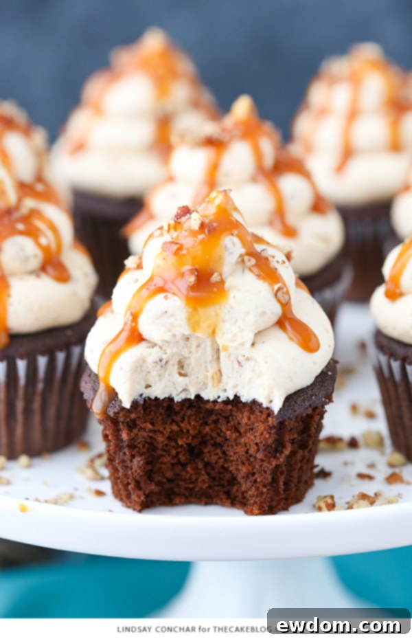 Gooey Chocolate Caramel Pecan Cupcakes 9 Chocolate Turtle Cupcakes - from scratch recipe for rich chocolate cupcakes with caramel pecan frosting, caramel drizzle and chopped pecans | by Lindsay Conchar for TheCakeBlog.com