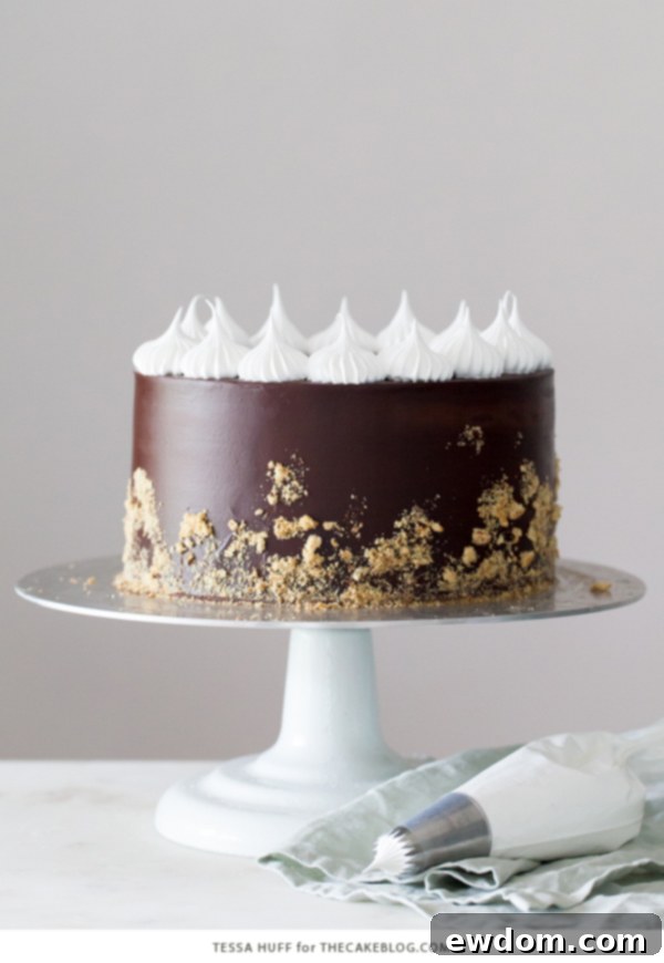 S'mores Cake - s'more inspired layer cake recipe with chocolate cake, graham cracker buttercream, chocolate ganache and toasted marshmallow meringue | by Tessa Huff for TheCakeBlog.com