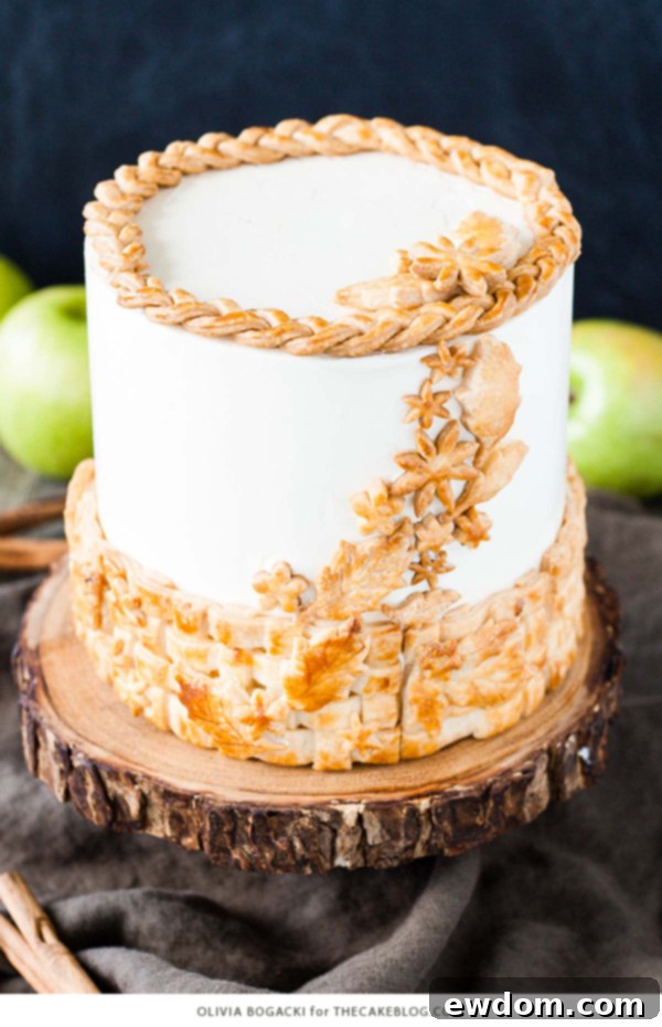 Stunning Apple Pie Layer Cake featuring a golden pie crust lattice, perfect for autumn desserts and holidays