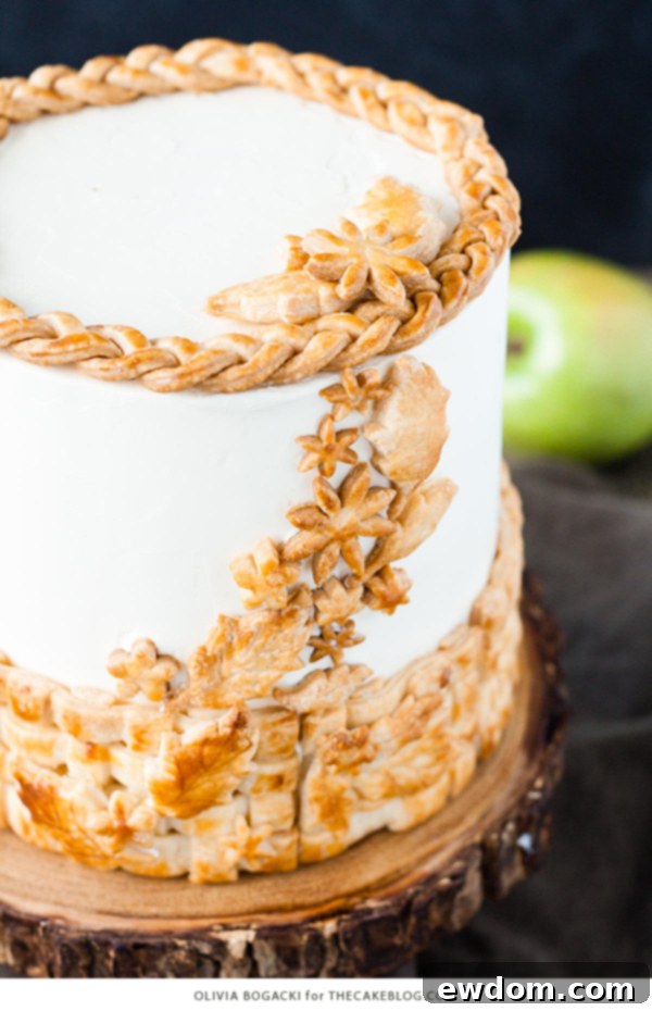 Close-up of a slice of Apple Pie Cake revealing moist layers, apple filling, and delicate pie crust details - a unique fall dessert recipe