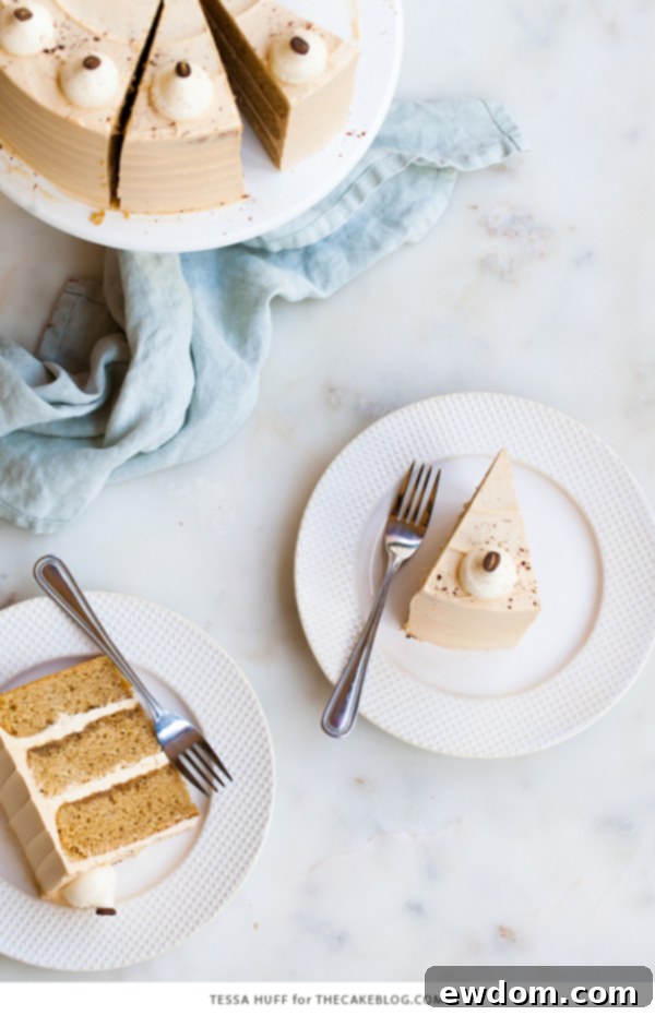 Caramel Cappuccino Cake - espresso cake paired with caramel buttercream frosting, topped with whole coffee beans and a sprinkle of cocoa powder | by Tessa Huff for TheCakeBlog.com