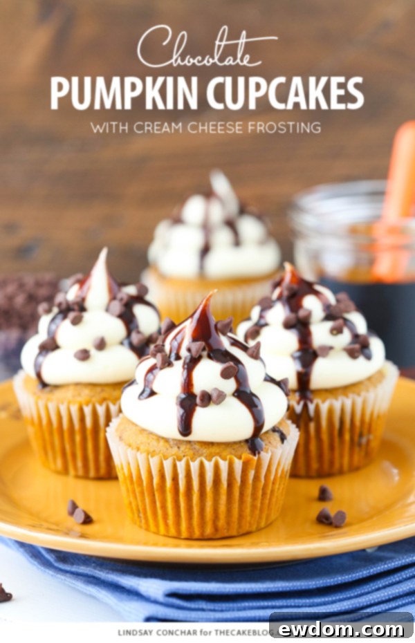Close-up shot of a single pumpkin chocolate chip cupcake, showcasing its rich frosting and chocolate chips