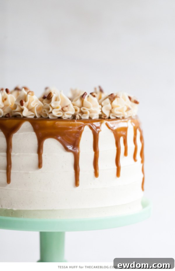 Apple Toffee Crunch Cake - fresh apple cake with crunchy pecans, cinnamon buttercream and a toffee sauce drip | by Tessa Huff for TheCakeBlog.com