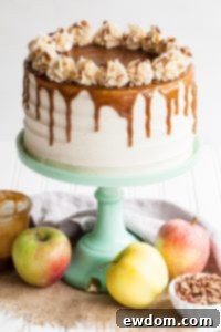 Apple Toffee Crunch Cake - fresh apple cake with crunchy pecans, cinnamon buttercream and a toffee sauce drip | by Tessa Huff for TheCakeBlog.com