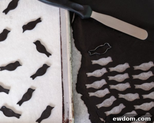 Baked black bird cookies, ready for cake decoration