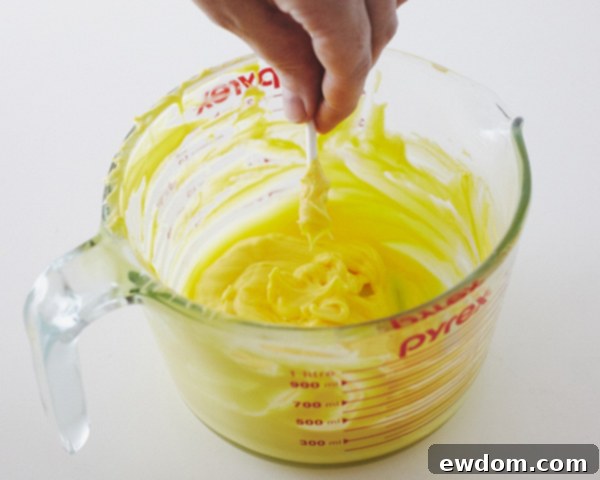 Attaching Sucker Sticks to the Back of Candy Moons with Melted Coating