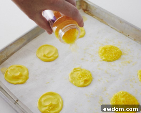 Sprinkling Yellow Sugar Crystals onto Wet Candy Moons
