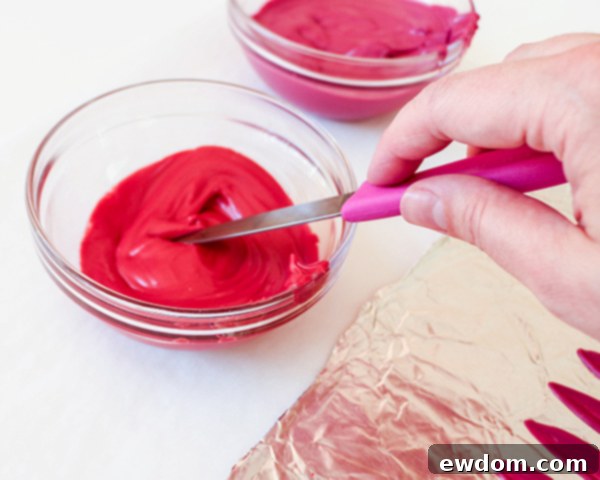 Detail view of creating the second color layer on chocolate petals for sunflower cake