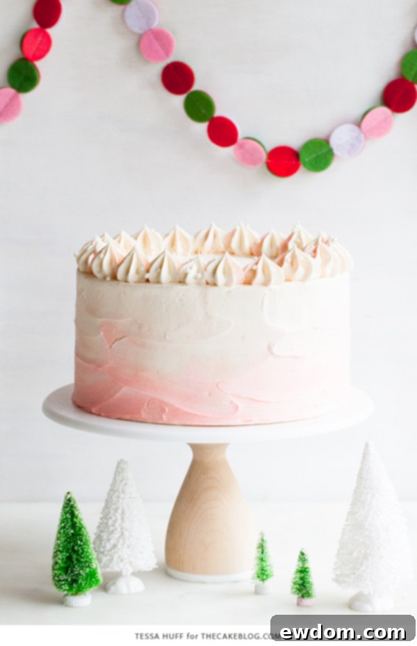 Close-up of a beautifully decorated Peppermint Red Velvet Cake showing detailed frosting and topping
