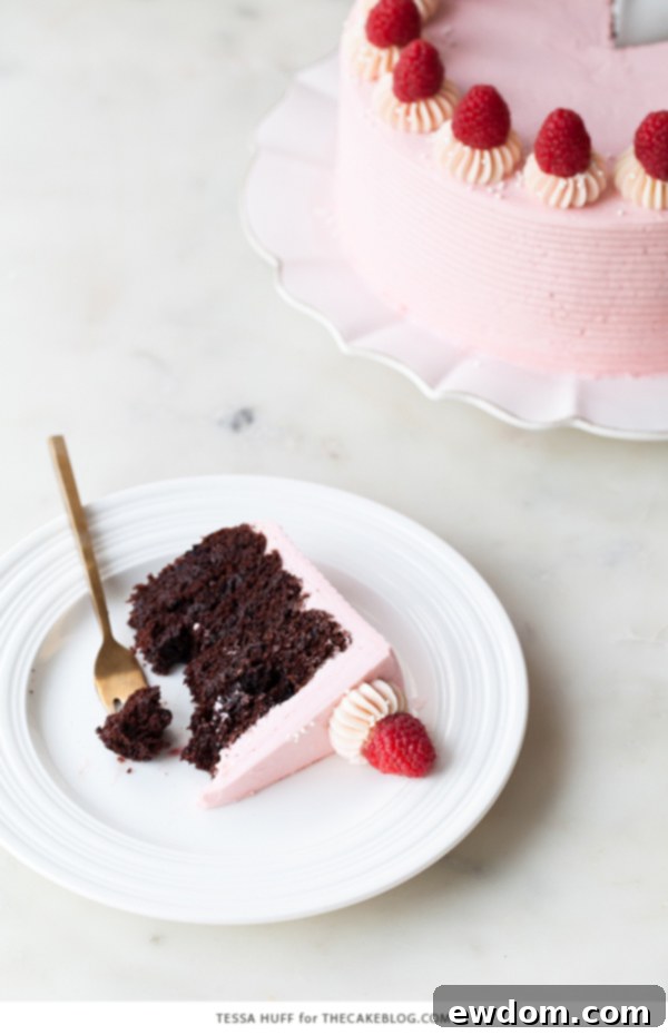 Chocolate Raspberry Cake - moist chocolate cake layered with raspberry jam, topped with raspberry cheesecake frosting and fresh red raspberries | by Tessa Huff for TheCakeBlog.com