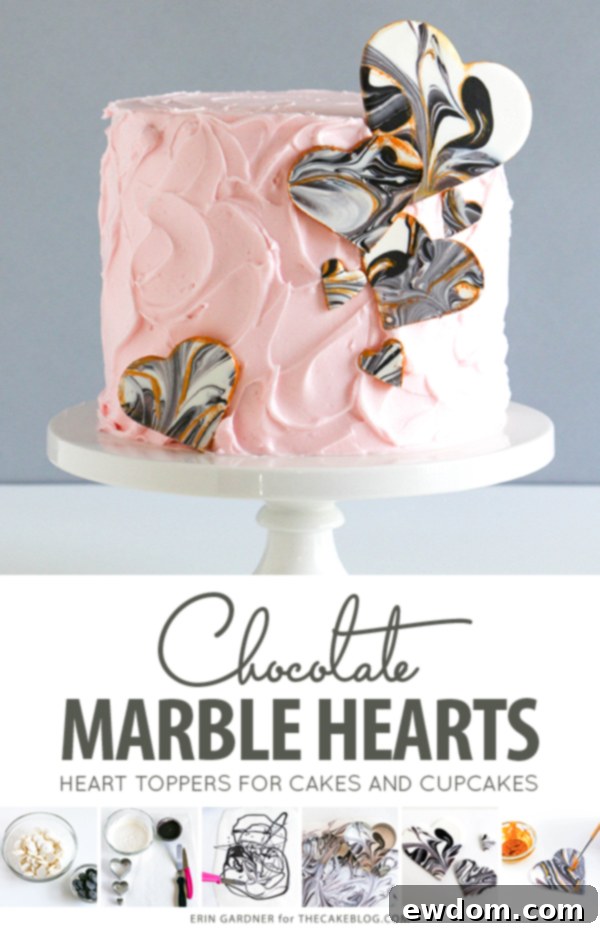 Marbled chocolate hearts adorning a beautifully iced cake, showcasing the elegant black and white marble effect with gold accents, perfect for sophisticated celebrations.