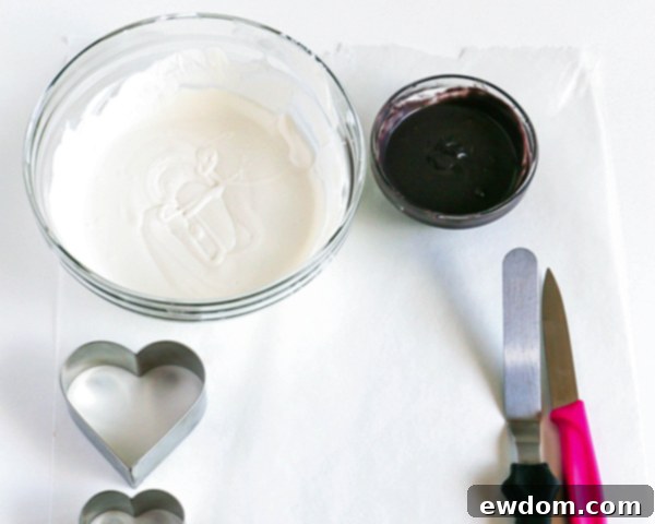 A closer view of the perfectly melted coating chocolates, illustrating the smooth and fluid consistency required for successful marbling.