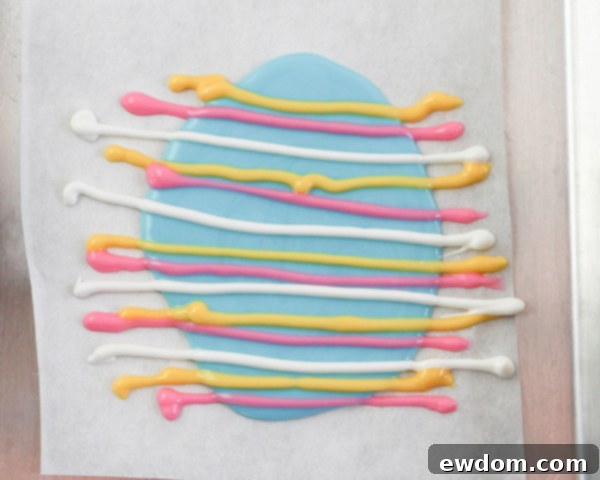 Elegant Swirl Easter Chocolates 13 Different colored chocolate lines piped across a wet chocolate base, forming a canvas for marbling.