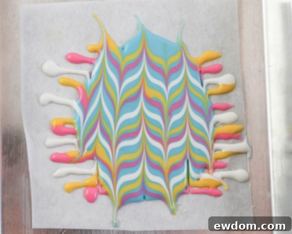 Elegant Swirl Easter Chocolates 16 The completed marbled chocolate pattern, showcasing intricate swirls and colors, ready for cutting.