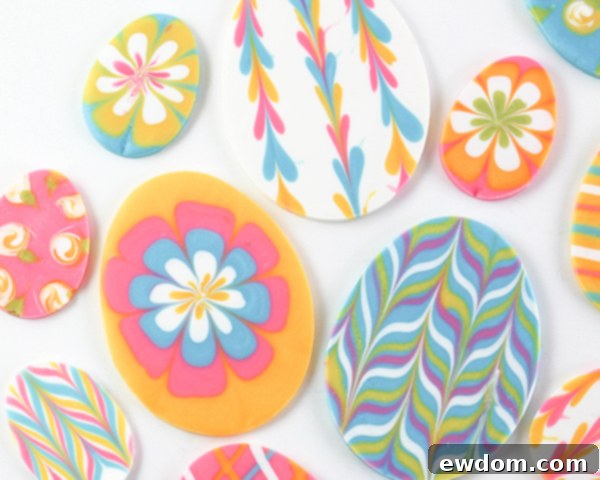 Elegant Swirl Easter Chocolates 19 A beautifully decorated cake adorned with colorful marbled chocolate Easter egg toppers and green frosting, ready for a celebration.