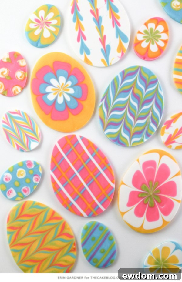 Elegant Swirl Easter Chocolates 5 Marbled chocolate egg cake topper resting on a pastel blue frosted cupcake, illustrating an easy Easter dessert decoration idea.