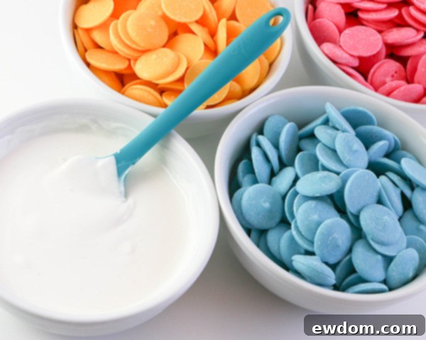 Elegant Swirl Easter Chocolates 6 Preparation of assorted colored coating chocolates in piping bags, ready for marbling on a heating pad.