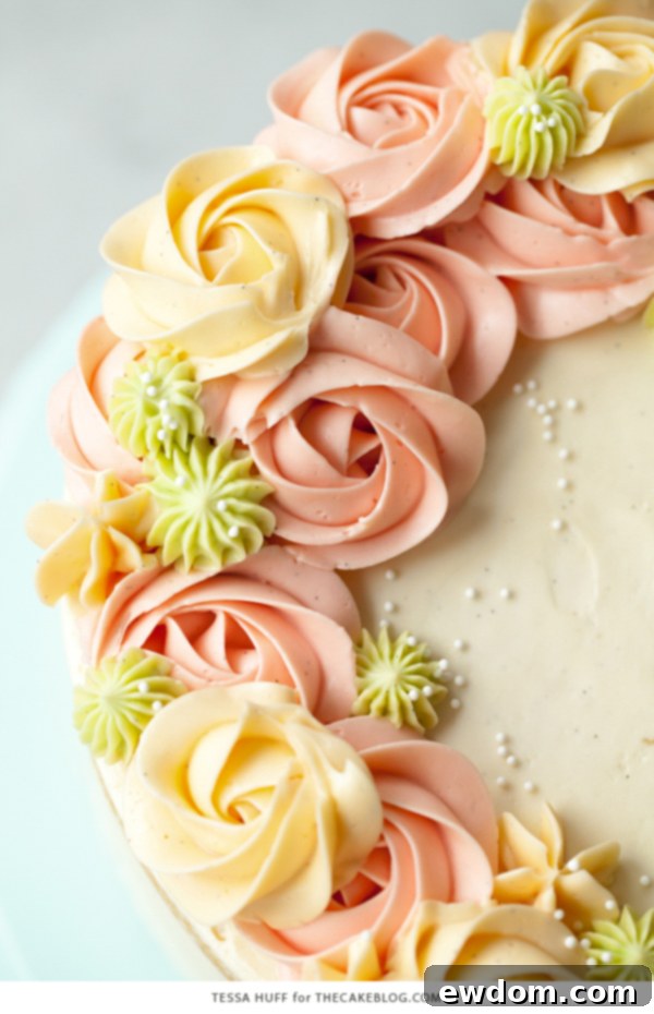 Coconut Cake - homemade coconut cake with creamy coconut milk, brushed with coconut syrup to keep it extra moist, and topped with vanilla bean buttercream frosting | by Tessa Huff for TheCakeBlog.com