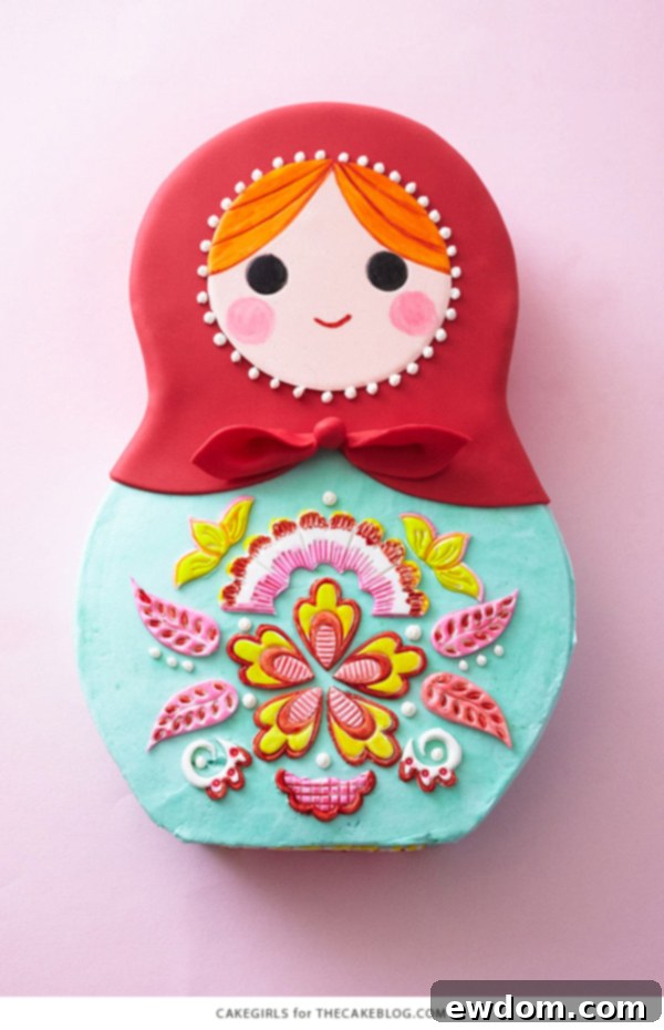 Matryoshka Magic Cake 4 Close-up of the Matryoshka doll cake, showcasing its vibrant folk art design for a baby shower. Cake by Cakegirls.
