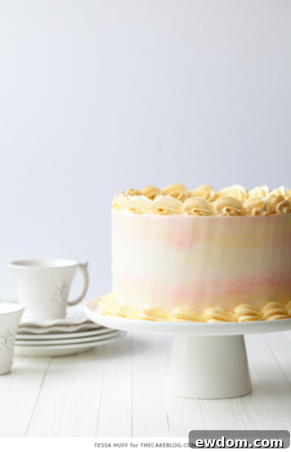 Serving slice of Lemon Honey Apricot Cake, showing internal layers and fillings