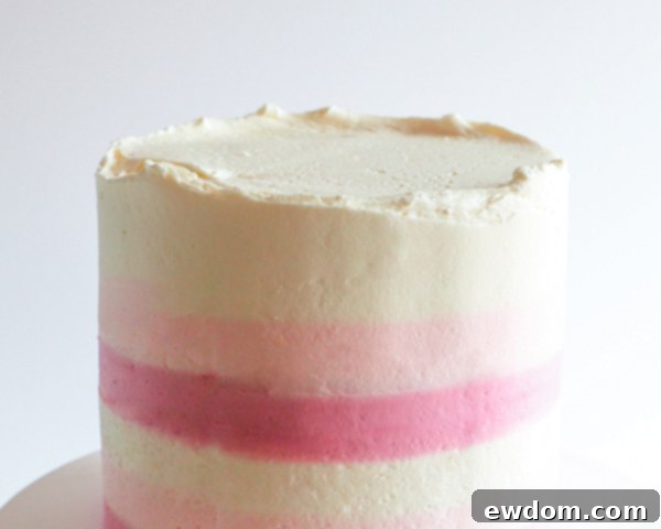 Technique for cleaning excess buttercream from a bench scraper during smoothing