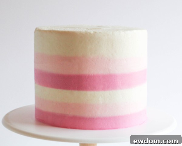 Final smooth top edge of a perfectly striped buttercream cake
