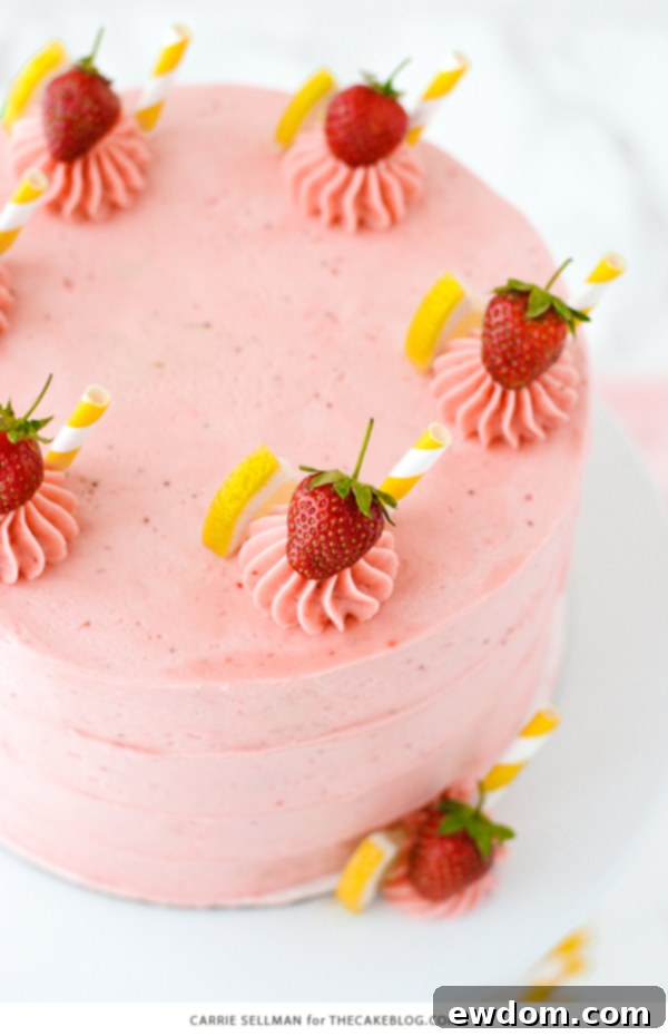 Strawberry Lemonade Cake - tender lemon cake paired with fresh strawberry buttercream | by Carrie Sellman for TheCakeBlog.com