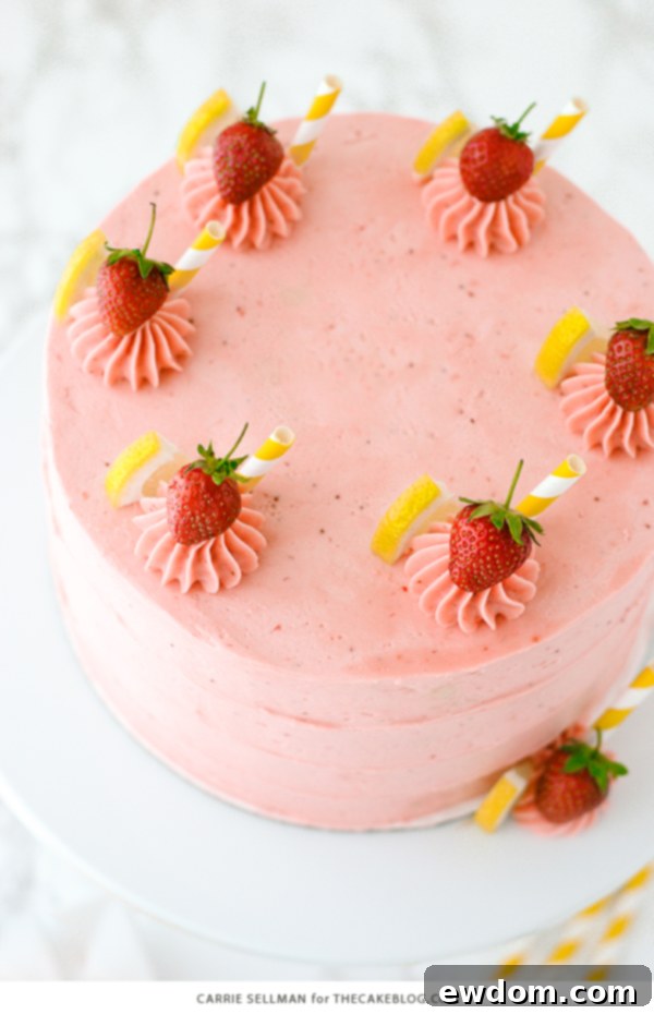 Strawberry Lemonade Cake - tender lemon cake paired with fresh strawberry buttercream | by Carrie Sellman for TheCakeBlog.com
