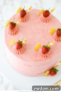 Strawberry Lemonade Cake - tender lemon cake paired with fresh strawberry buttercream | by Carrie Sellman for TheCakeBlog.com