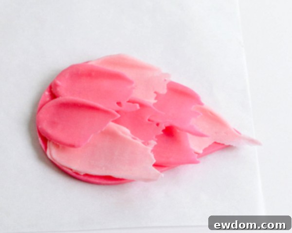 Pink Paradise Flamingo Cake 31 Layering multiple brushstroke feathers onto the flamingo body, creating a full plumage effect