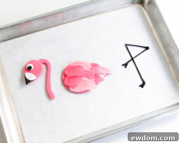 Pink Paradise Flamingo Cake 32 The three completed chocolate flamingo components: head/neck, feathered body, and legs