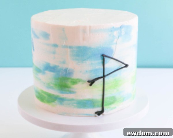 Pink Paradise Flamingo Cake 36 Placing the chocolate flamingo legs onto the watercolor buttercream cake