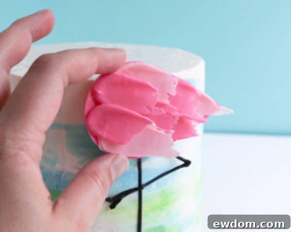 Pink Paradise Flamingo Cake 38 Attaching the feathered flamingo body to the cake, just above the legs
