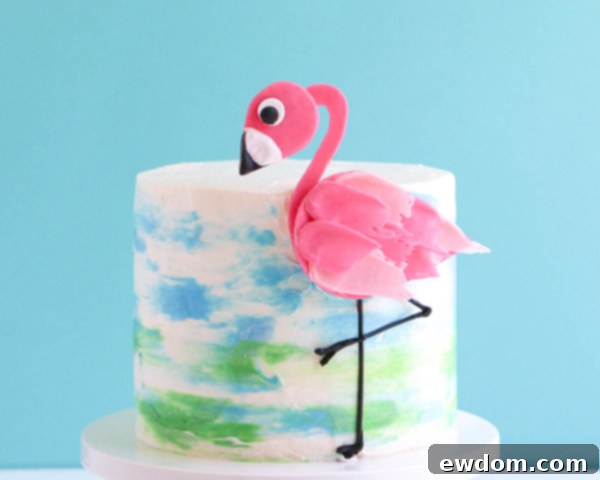 Pink Paradise Flamingo Cake 40 The assembled chocolate flamingo standing gracefully on the watercolor buttercream cake
