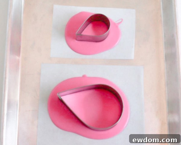 Pink Paradise Flamingo Cake 7 Placing tear drop cutters into the setting bright pink chocolate for shaping