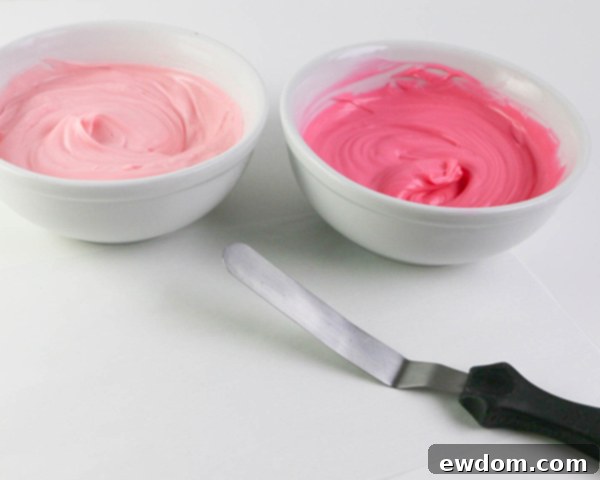 Pink Paradise Flamingo Cake 8 Dipping an offset spatula into bright pink chocolate for brushstroke feathers