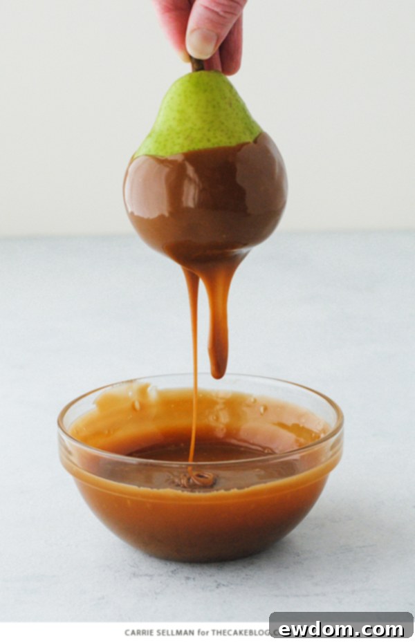 Decadent Salted Caramel Pear Delight 5 Hand-dipped fresh pears generously coated in rich, homemade caramel, ready for cake decoration.