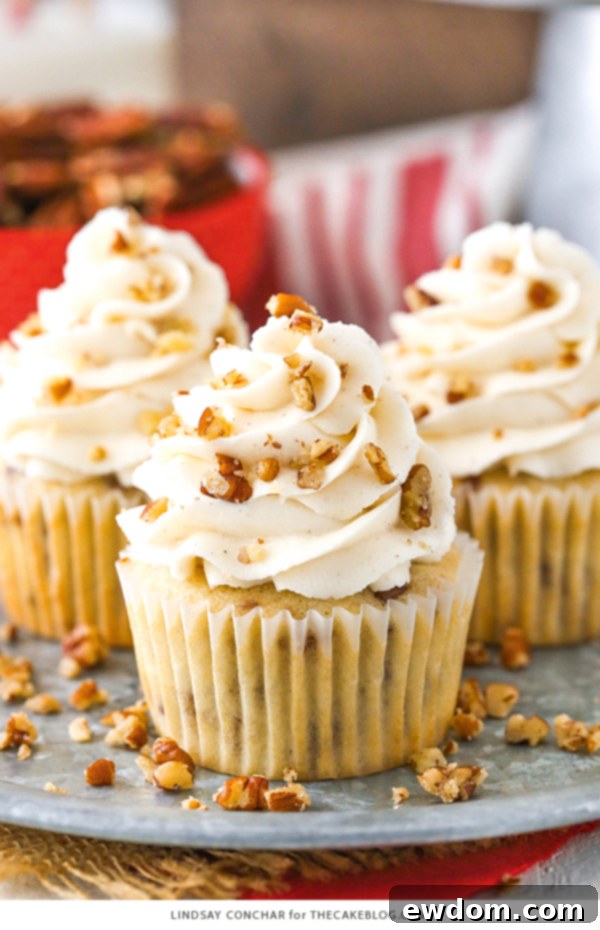Butter Pecan Cupcakes - moist vanilla cupcakes studded with toasted butter pecans and topped with cinnamon buttercream frosting | A delightful fall treat