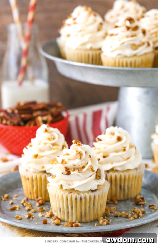 Butter Pecan Cupcakes - moist vanilla cupcakes studded with toasted butter pecans and topped with cinnamon buttercream frosting | The perfect frosting balance