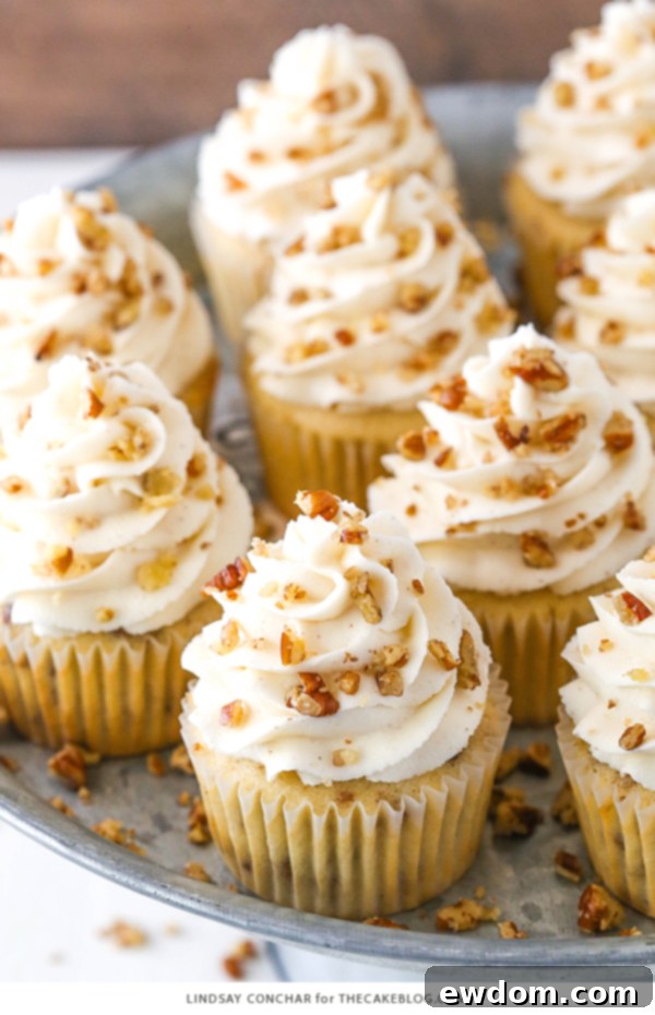 Butter Pecan Cupcakes - moist vanilla cupcakes studded with toasted butter pecans and topped with cinnamon buttercream frosting | Frosting is the best part!