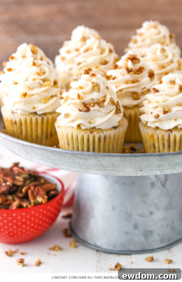 Butter Pecan Cupcakes - moist vanilla cupcakes studded with toasted butter pecans and topped with cinnamon buttercream frosting | A true fall classic