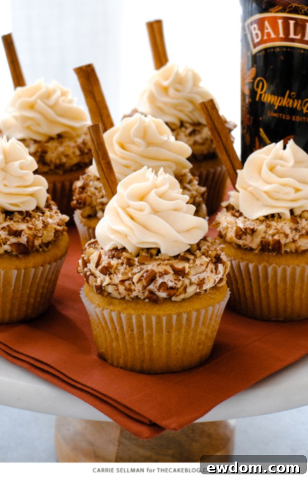 A tray of freshly baked Baileys Pumpkin Spice Cupcakes with intricate frosting | by Carrie Sellman for TheCakeBlog.com