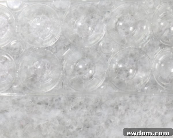 Chocolate Lollipop Ghosts - how to make edible lollipop ghosts for Halloween cakes and cupcakes using white chocolate and suckers | by Erin Gardner for TheCakeBlog.com