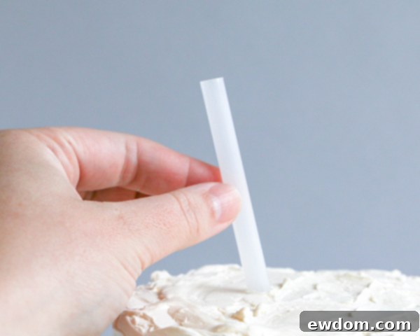 Chocolate Lollipop Ghosts - how to make edible lollipop ghosts for Halloween cakes and cupcakes using white chocolate and suckers | by Erin Gardner for TheCakeBlog.com