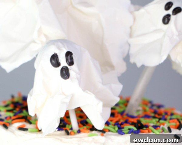 Chocolate Lollipop Ghosts - how to make edible lollipop ghosts for Halloween cakes and cupcakes using white chocolate and suckers | by Erin Gardner for TheCakeBlog.com