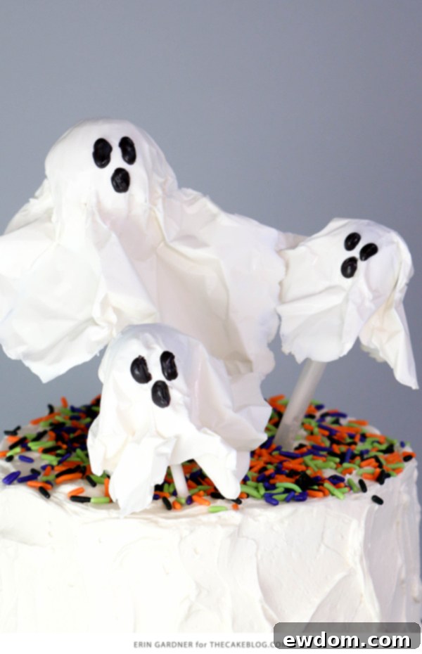Chocolate Lollipop Ghosts - how to make edible lollipop ghosts for Halloween cakes and cupcakes using white chocolate and suckers | by Erin Gardner for TheCakeBlog.com